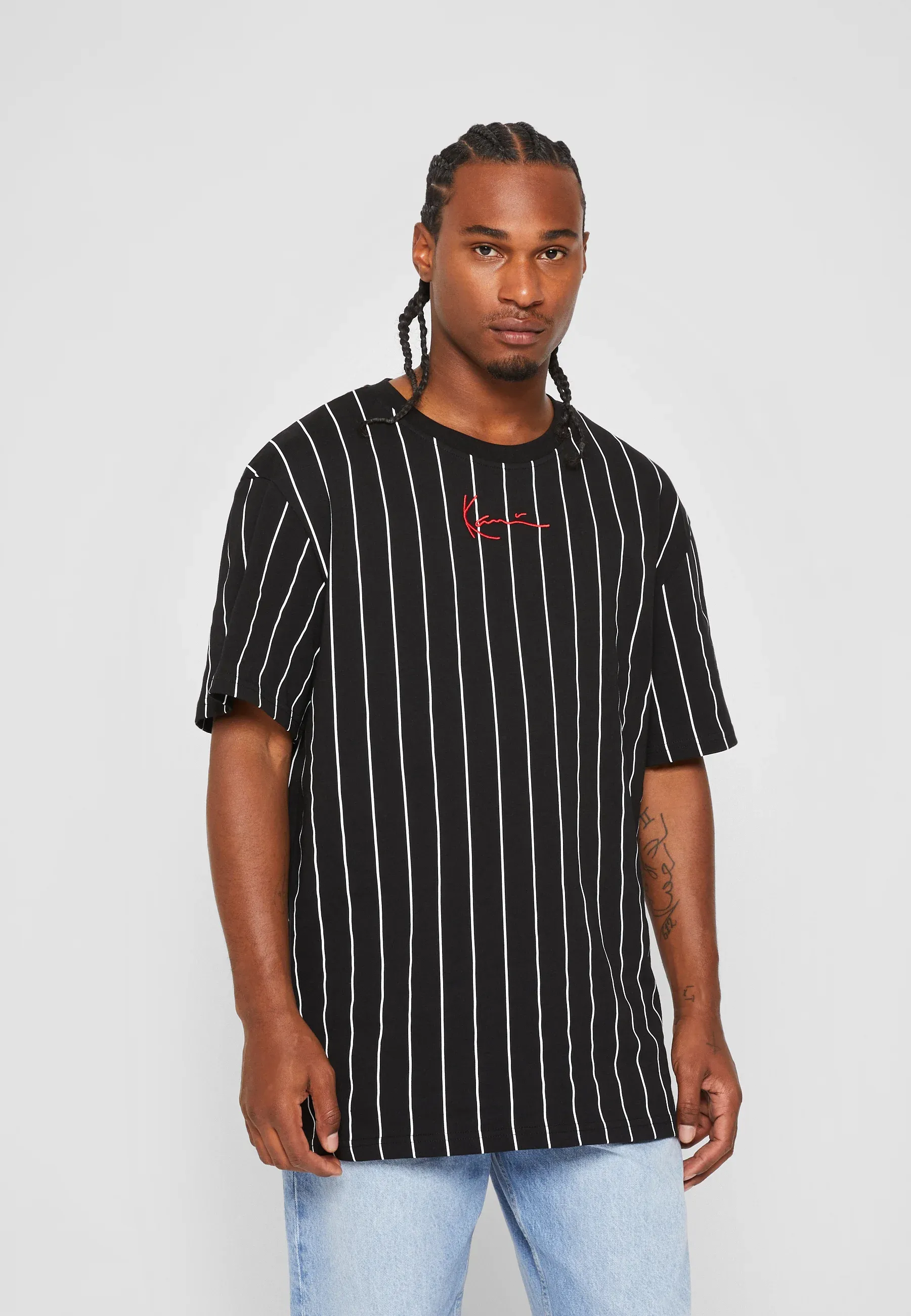 Karl Kani Small Signature Pinstripe Tee T-shirt unisexe à imprimé Noir/Blanc
